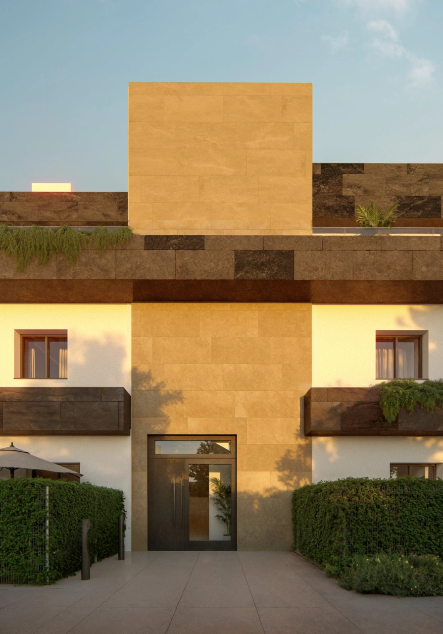 En detaljerad vy över den moderna arkitekturen och huvudentrén till bostäderna.