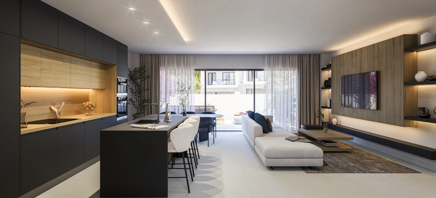 Det öppna vardagsrummet kombinerar kök, matplats och sällskapsutrymmen för en smidig, modern livsstil.