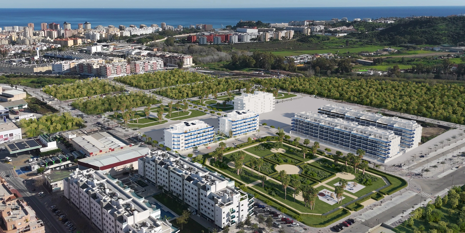 Ett fågelperspektiv över Laguna One-området, som visar dess integration i det omgivande gröna landskapet och närheten till havet.