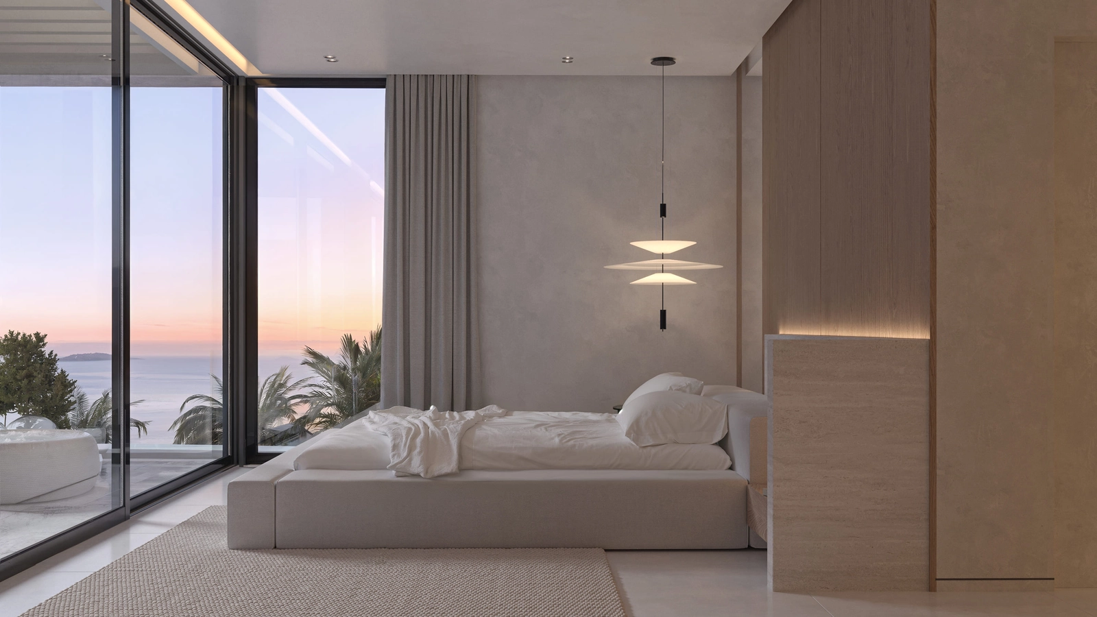 Ett lugnt och stilfullt sovrum med direkt tillgång till en privat terrass genom stora glasdörrar.