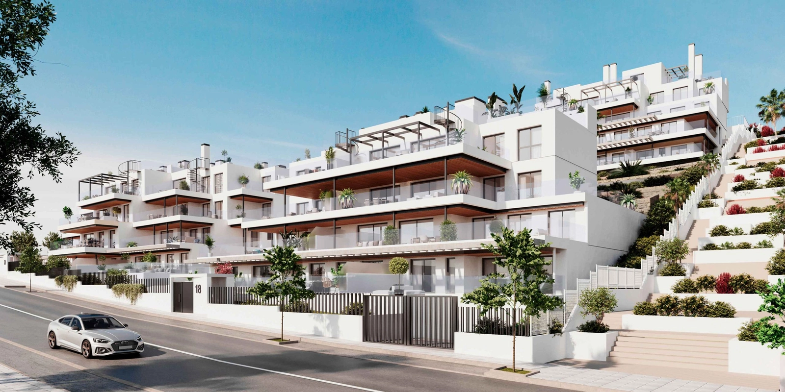 En modern arkitektonisk design som vackert integreras med det omgivande landskapet i Estepona.