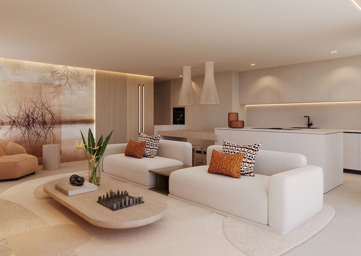 Ett elegant, modernt kök utrustat med exklusiva vitvaror, sömlöst integrerat i vardagsrums- och matplatsen.