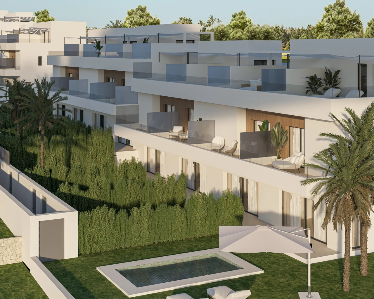 En flygvy över bostadsområdet, som visar upp den moderna arkitekturen och de privata trädgårdarna.