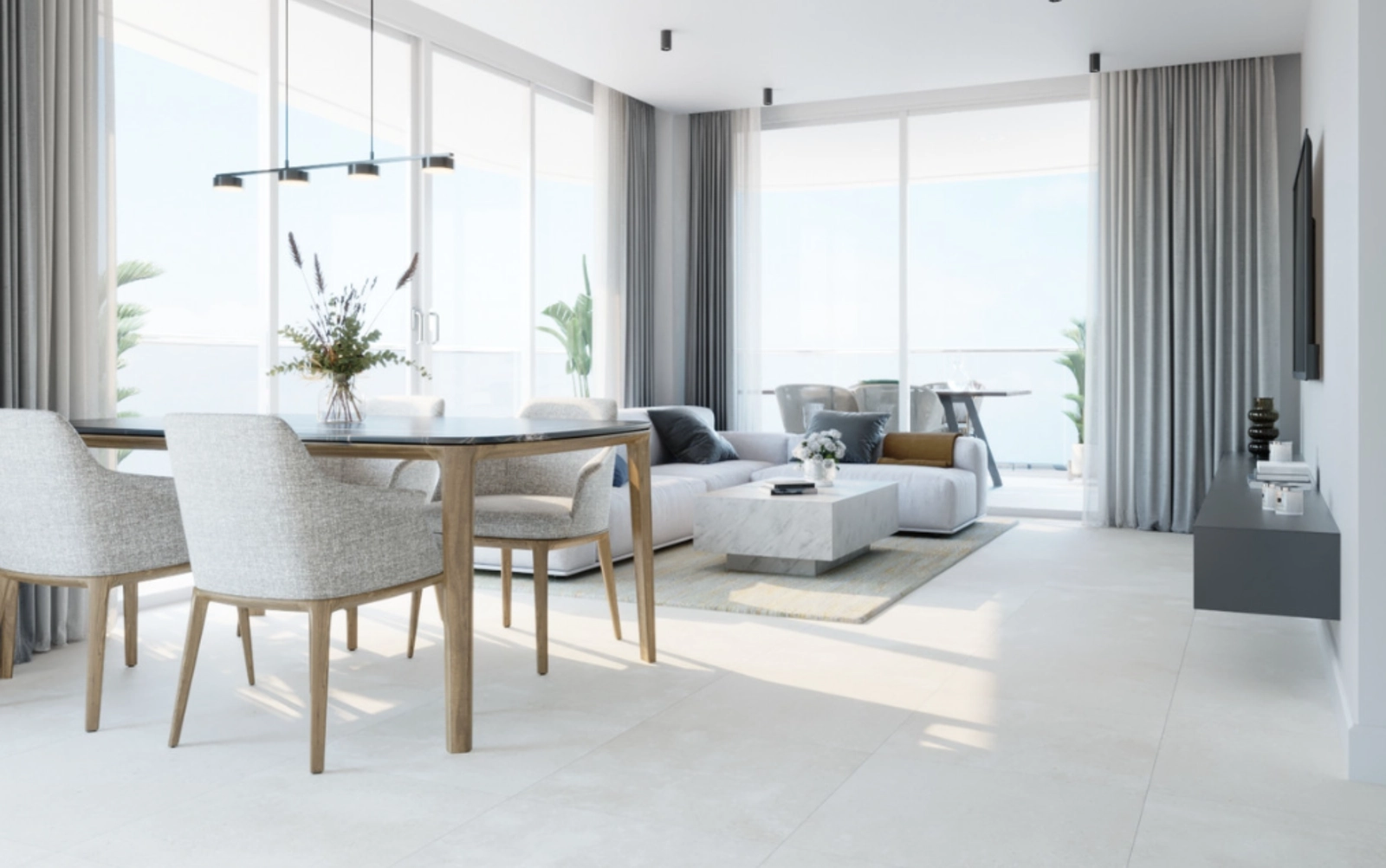 Ett rymligt och ljust vardagsrum och matplats, designat för komfort och elegans.