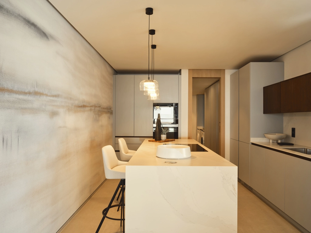 Ett toppmodernt kök med exklusiva vitvaror och minimalistisk design, perfekt för vardagsliv och underhållning.