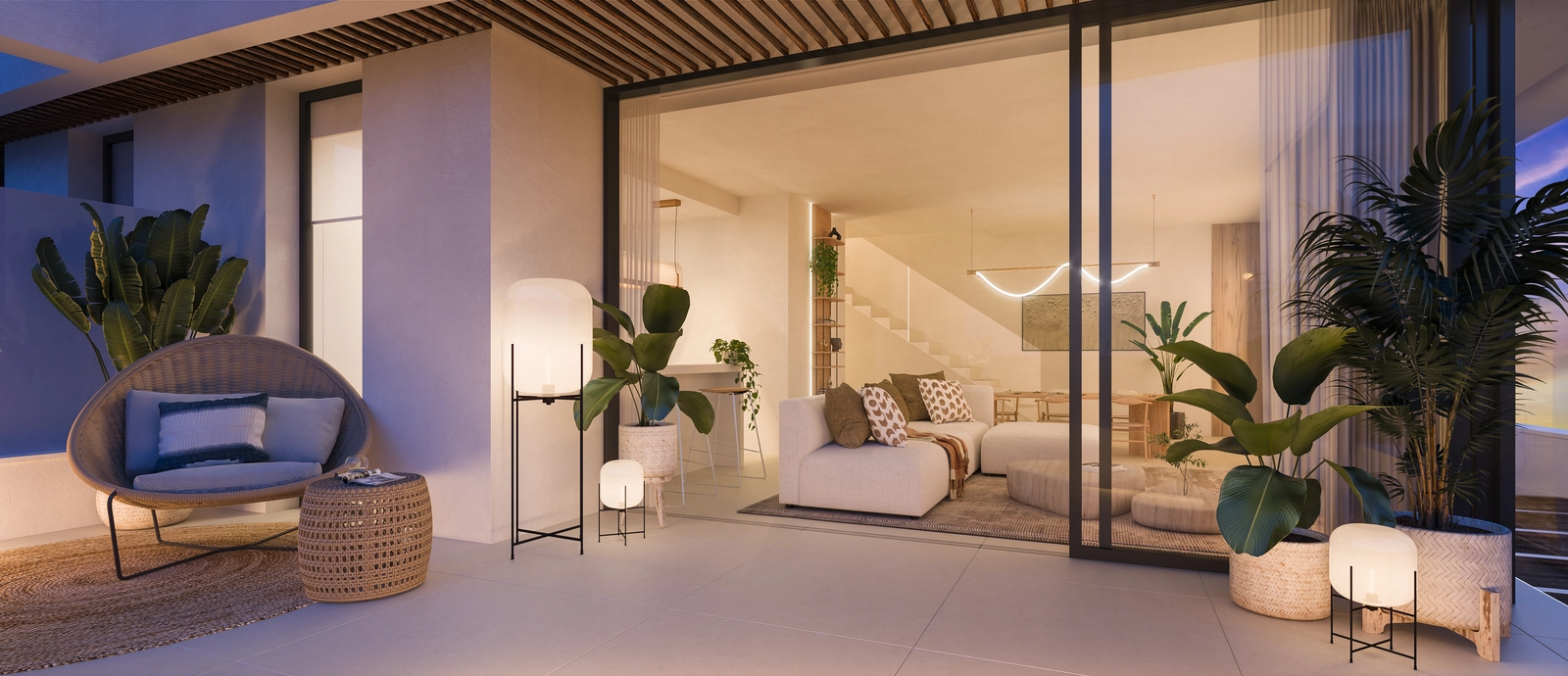 Ett elegant vardagsrum som öppnar upp mot en rymlig terrass för en sömlös övergång mellan inne och ute.