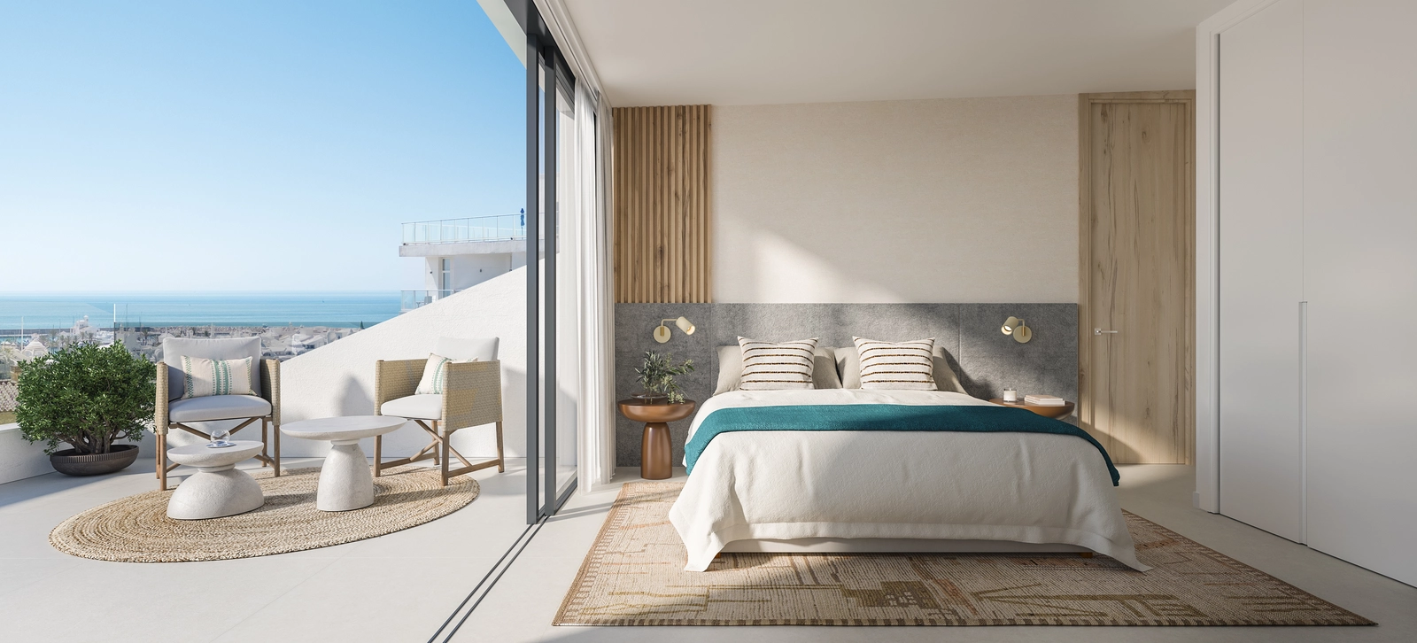 Ett ljust och rofyllt sovrum med direkt tillgång till en terrass med vacker havsutsikt.