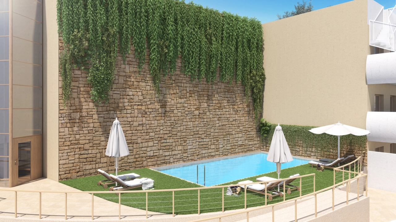 En av de två inbjudande utomhuspoolerna, belägen i vackert anlagda gemensamma trädgårdar.