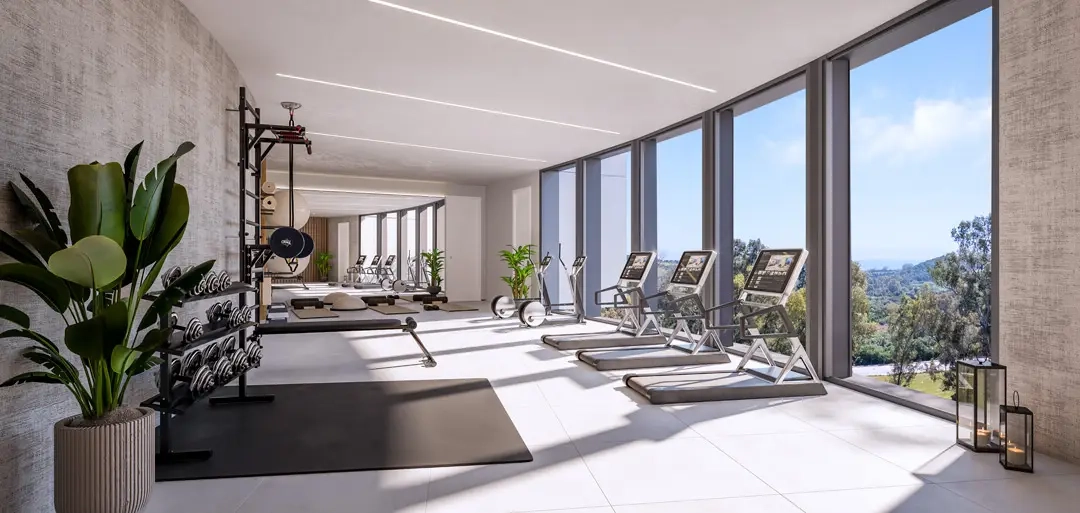 Håll dig aktiv i det fullt utrustade gymmet med utsikt över den omgivande naturen.