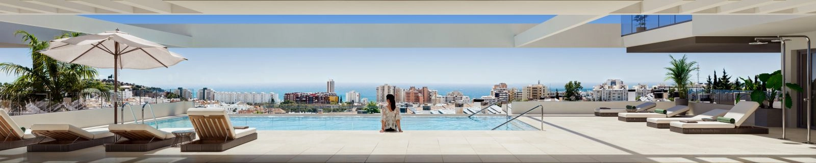 Infinitypoolen på taket erbjuder en perfekt plats att koppla av och njuta av den panoramiska havsutsikten.