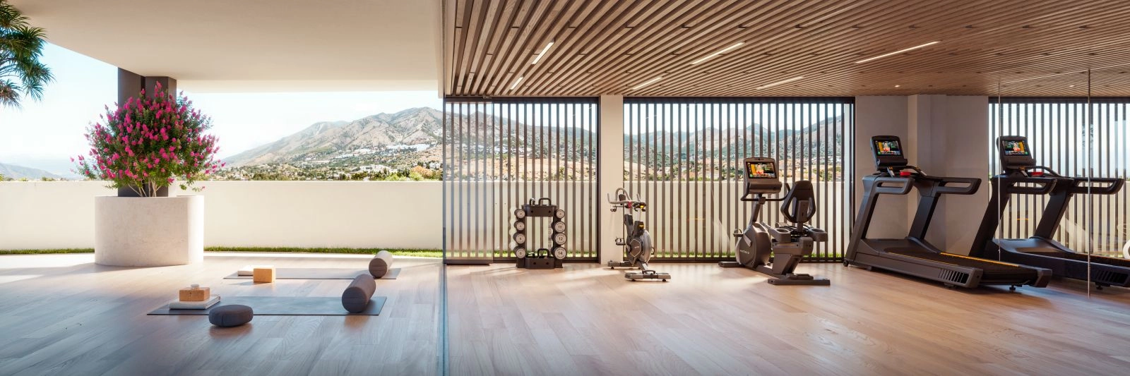 Det toppmoderna gymmet och wellnessområdet erbjuder inspirerande utsikt över bergen.