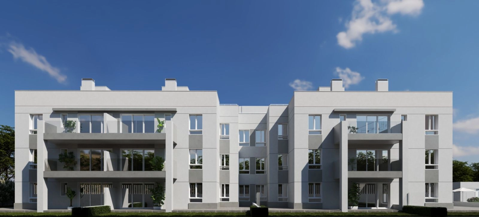 Byggnadens moderna arkitektur smälter harmoniskt in i den gröna omgivningen.