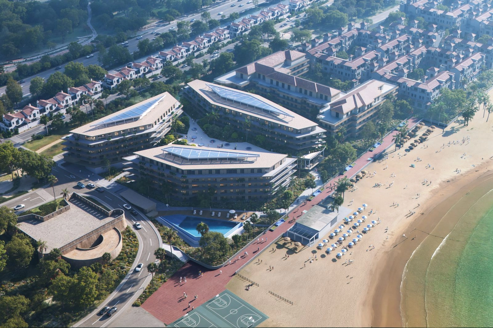 Ett flygperspektiv som visar områdets förstklassiga strandnära läge och moderna arkitektur.