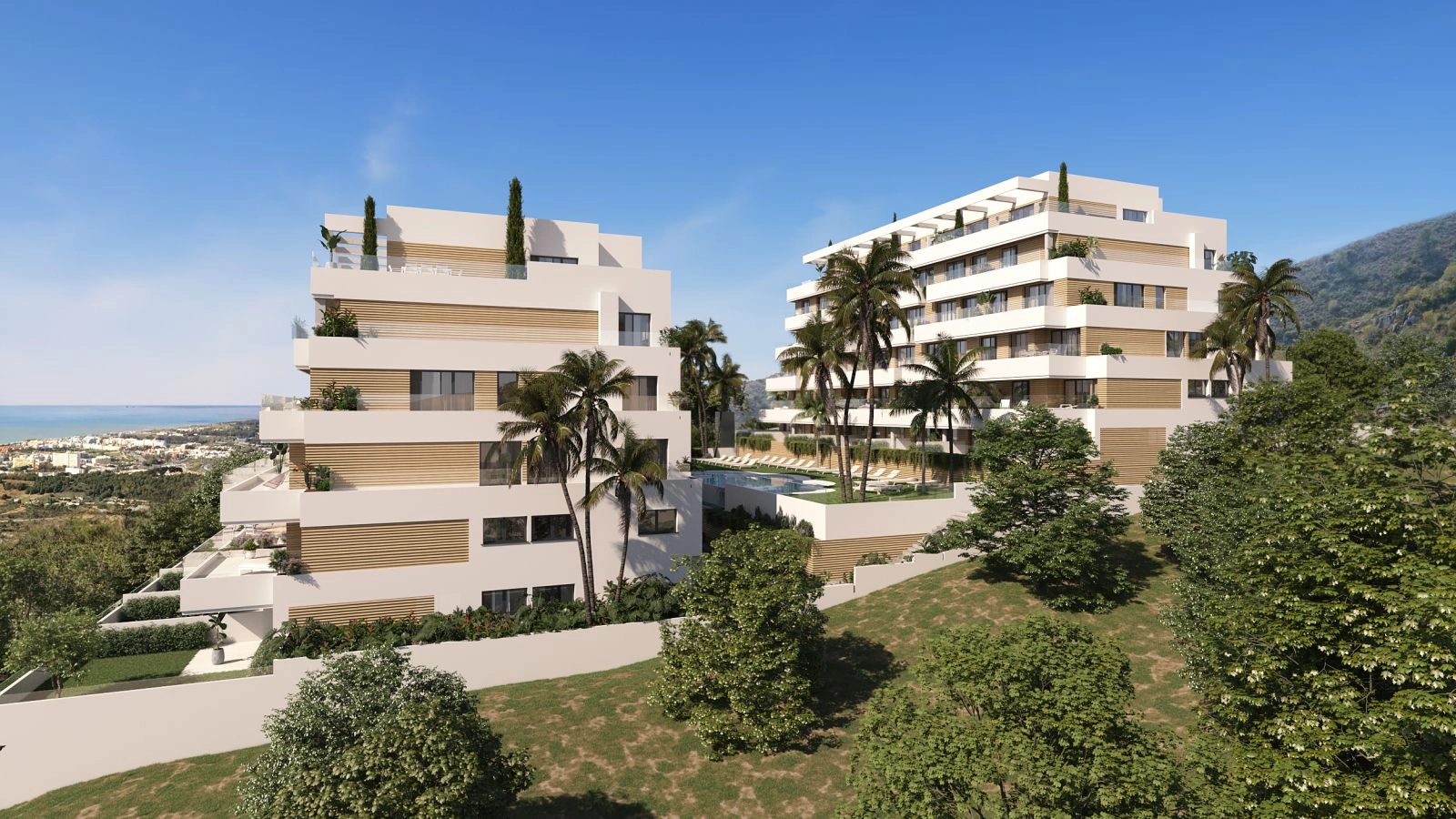 En förhöjd vy över det moderna bostadskomplexet, som visar dess fantastiska arkitektur och utsikt mot Medelhavet.