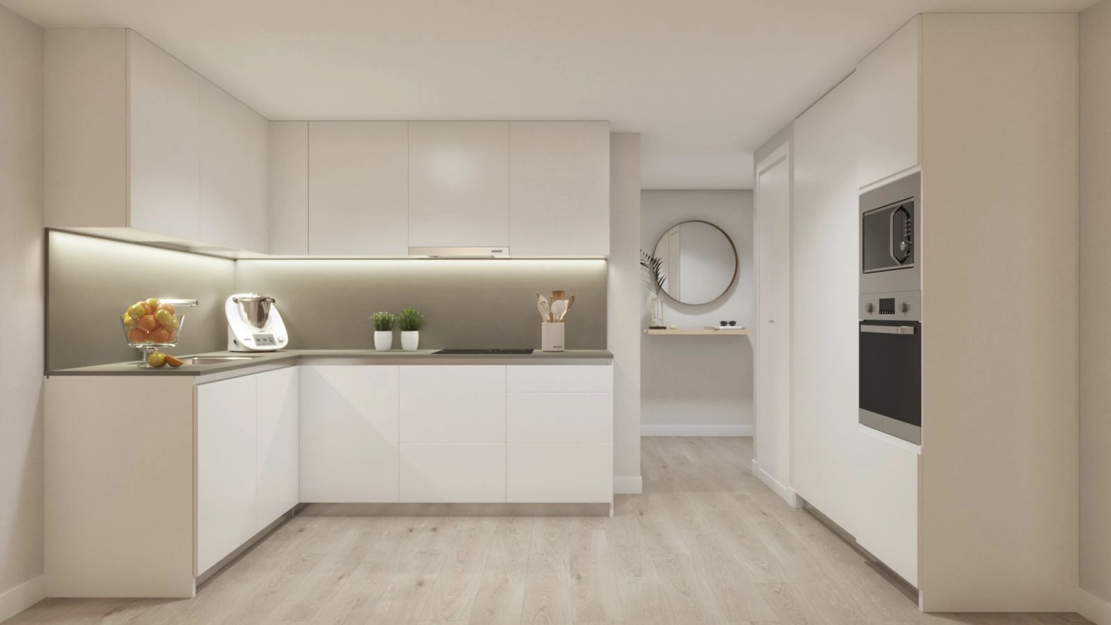 Det moderna, öppna köket är fullt utrustat och designat med rena linjer och högkvalitativa ytor.