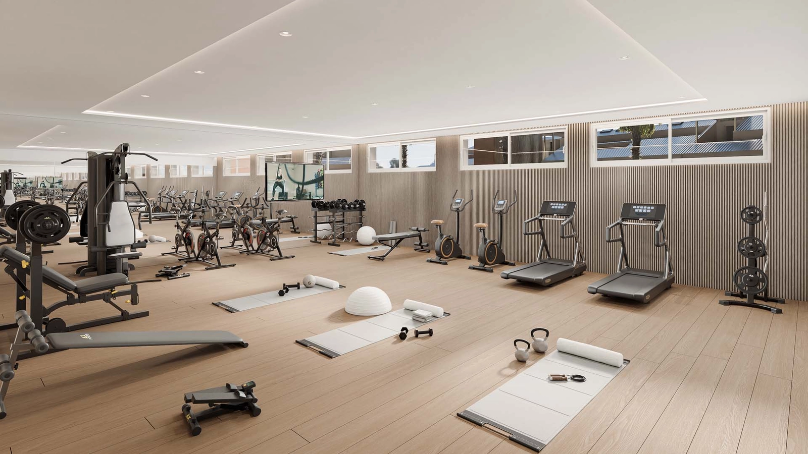 Ett fullt utrustat, toppmodernt gym för boendes hälsa och välbefinnande.