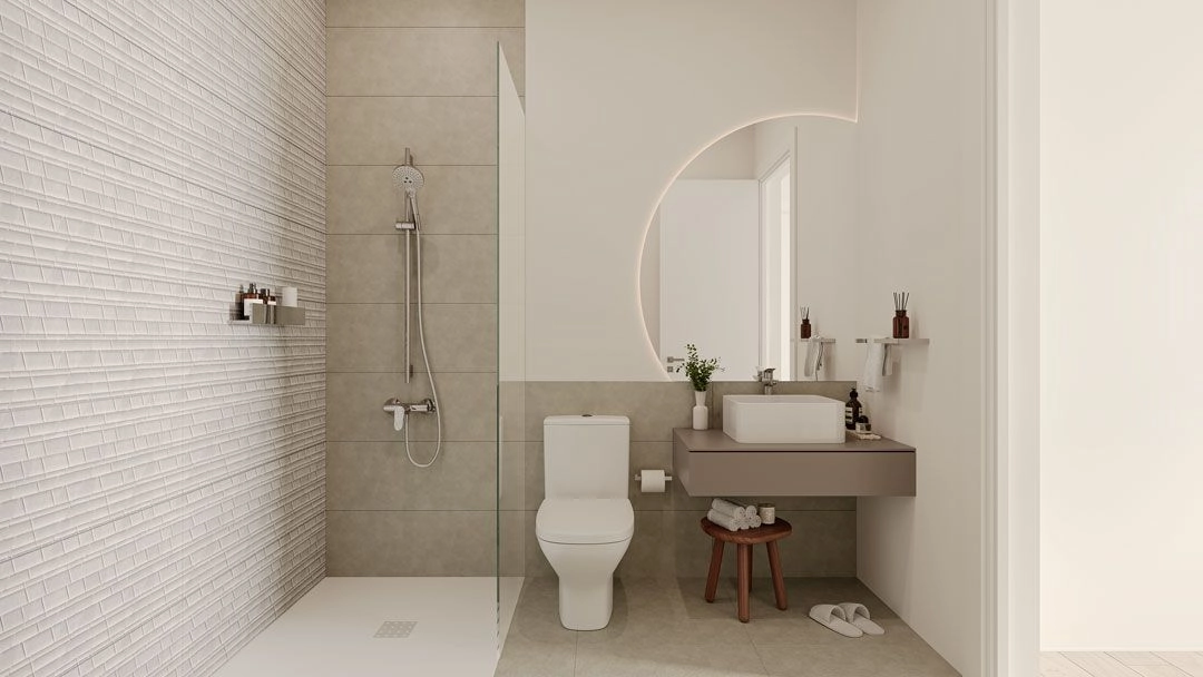 Ett elegant badrum med modern inredning och högkvalitativa material för en spa-liknande känsla.
