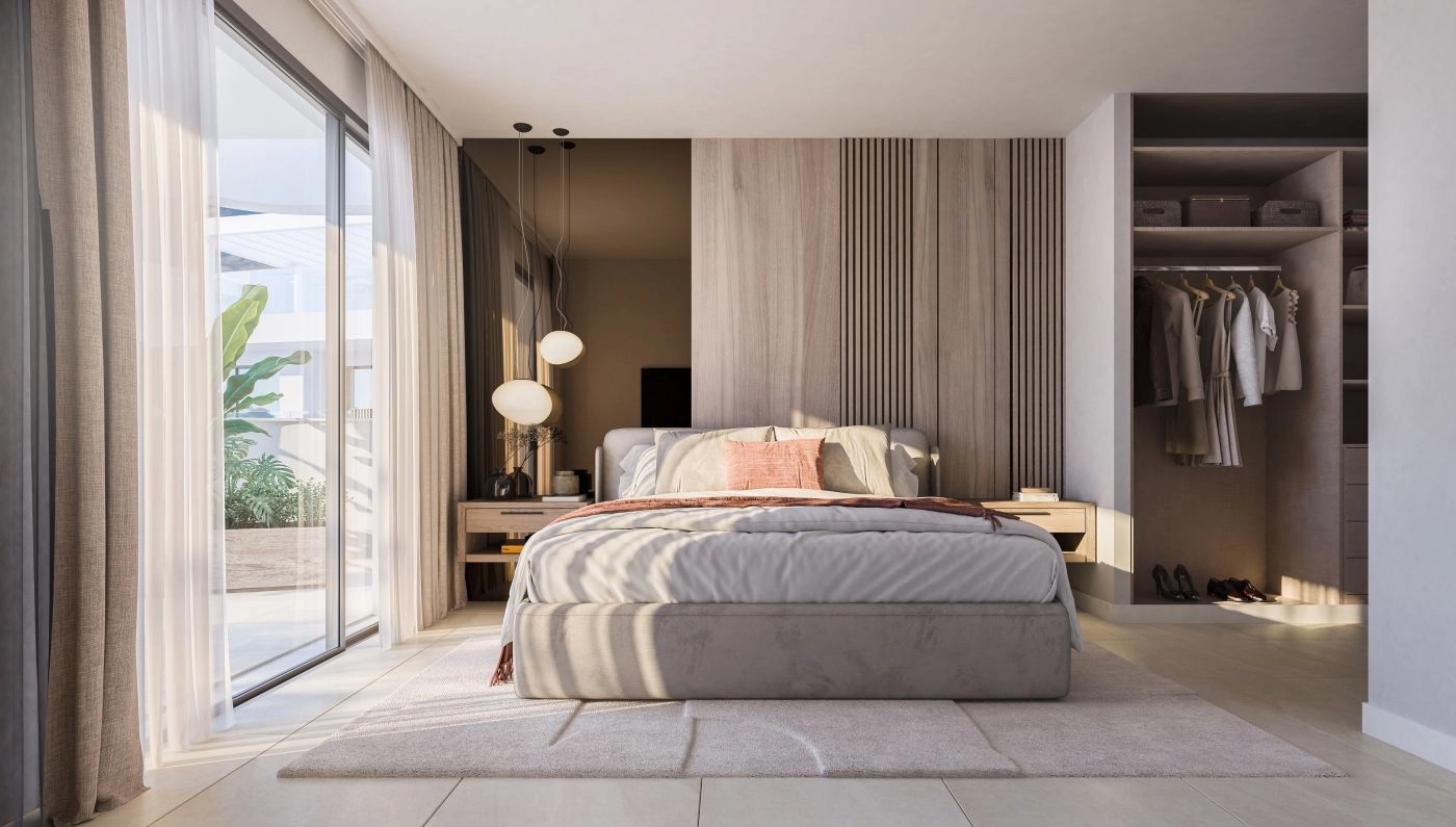 Ett rofyllt master sovrum med elegant design, gott om förvaring och direkt tillgång till en privat terrass.