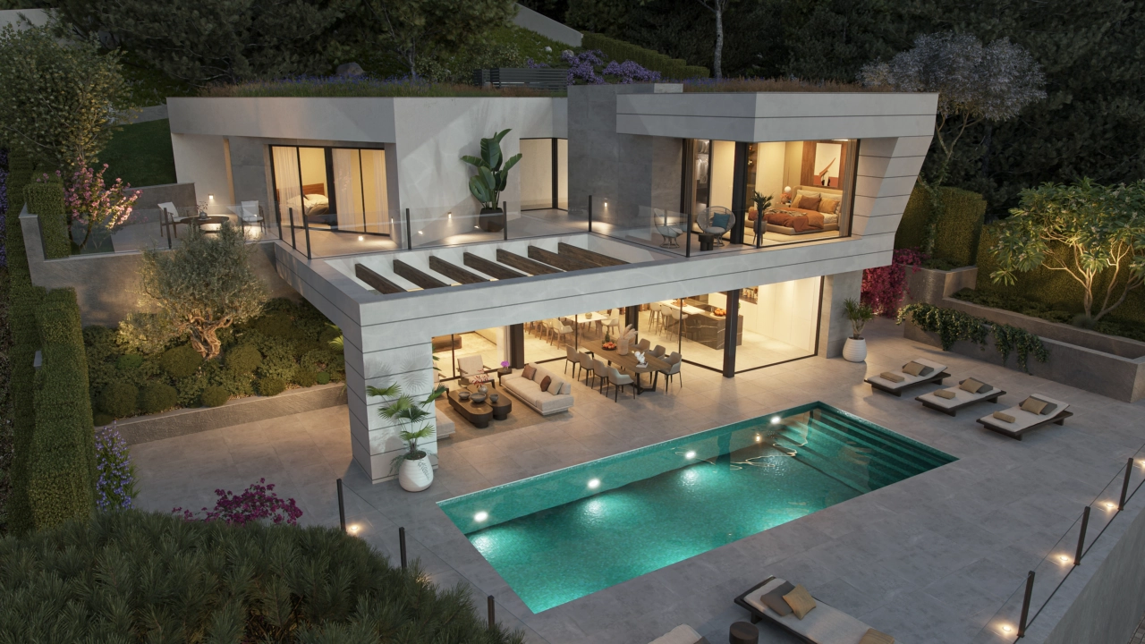 En kvällsvy över villan, där elegant belysning skapar en varm och inbjudande atmosfär.