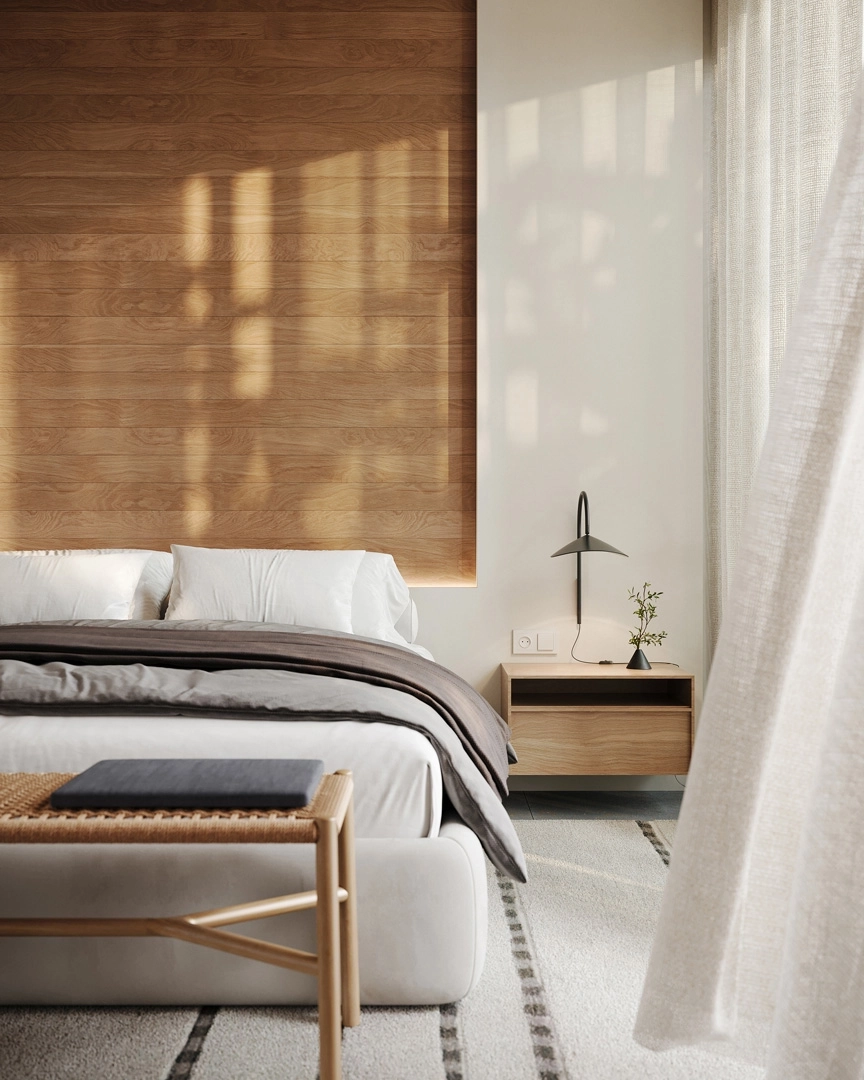 Huvudsovrummet är en fridfull tillflyktsort, med naturmaterial och stora fönster som välkomnar morgonljuset.