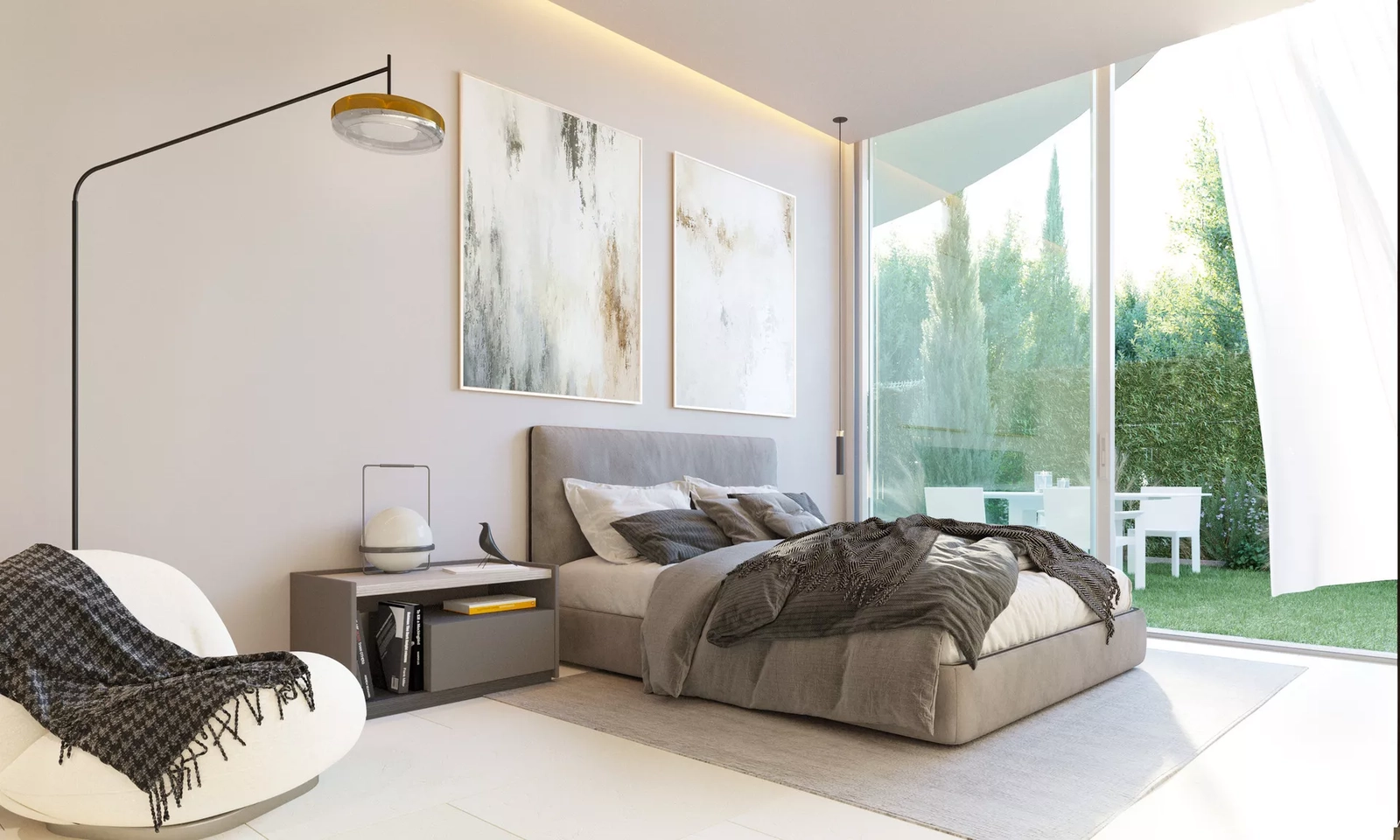 Ett bekvämt sovrum med stora skjutdörrar i glas som öppnar direkt mot Medelhavsträdgården.