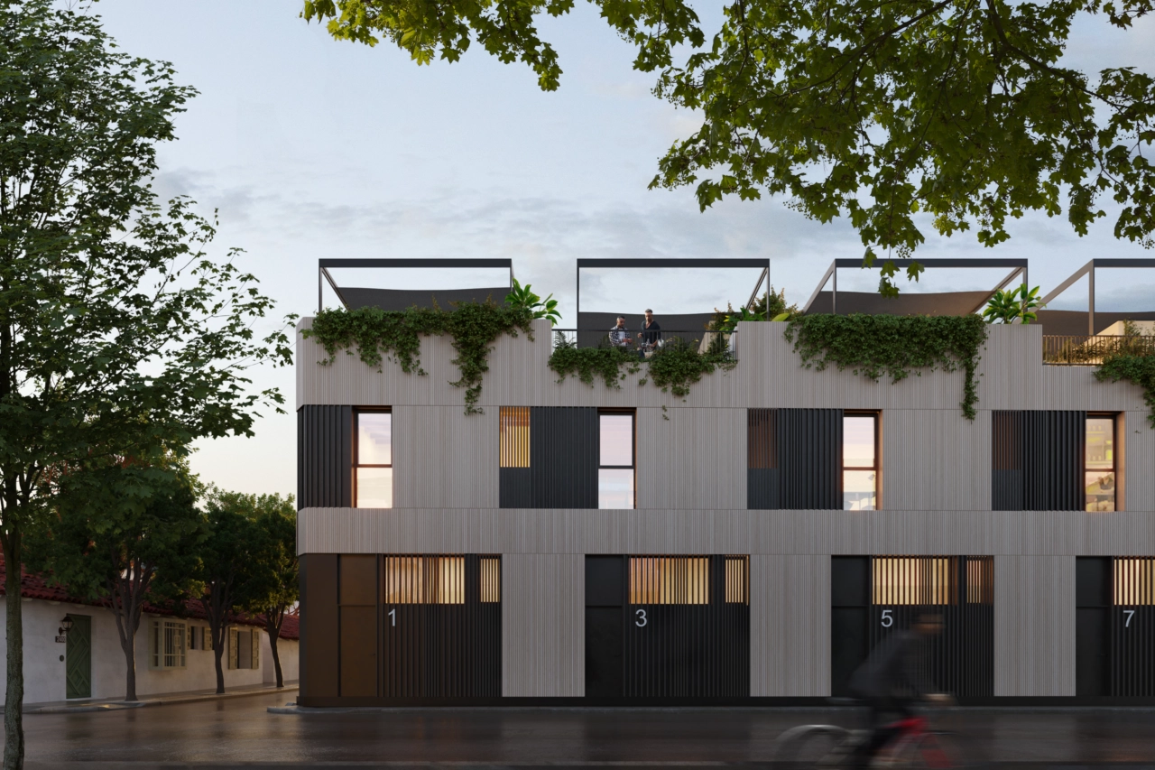 En kvällsvy över området, som visar upp dess varma belysning och eleganta arkitektur.