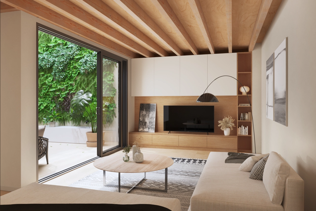 Ett stilfullt vardagsrum med utsikt över den lugna innergården med en grön vägg.