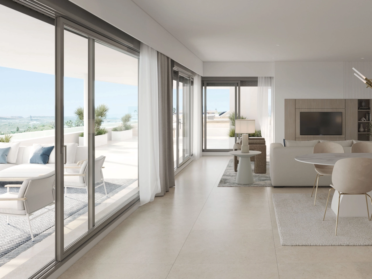 Ett ljust och rymligt vardagsrum, sömlöst anslutet till utomhusterrassen.